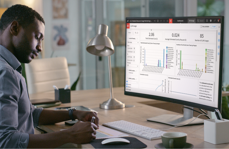 man sitting at desk with computer screen opening showing Dataiku Cost Guard with LLM Guard Services cost monitoring dashboards